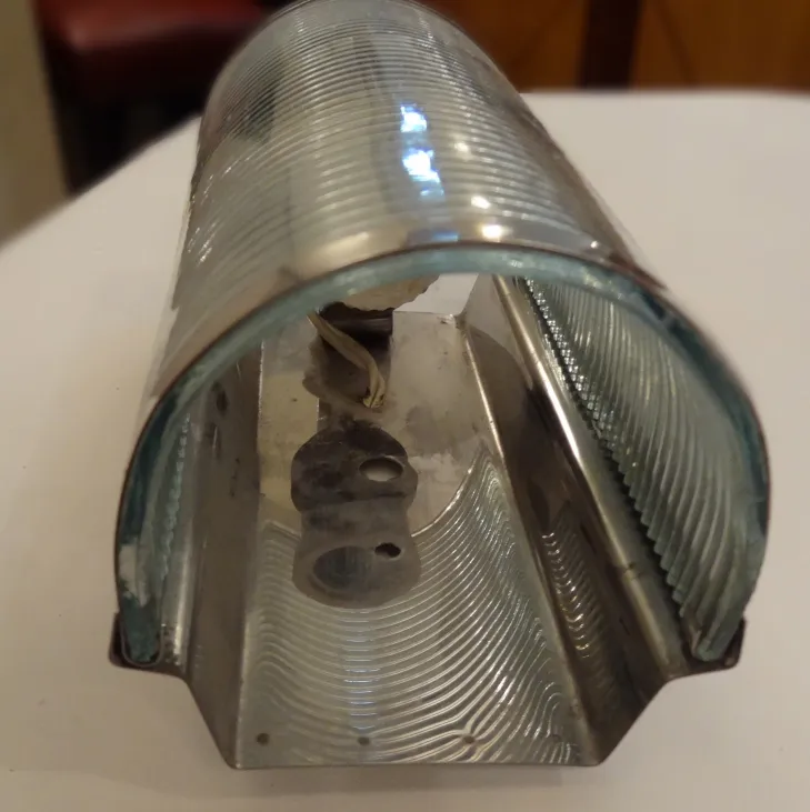 Pair of antique sconces featuring elegant design and glass