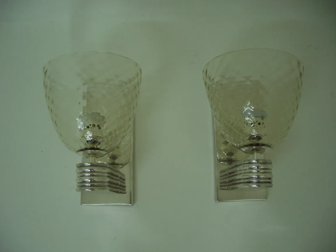 Antique pair of sconces with a cup-like glass shade