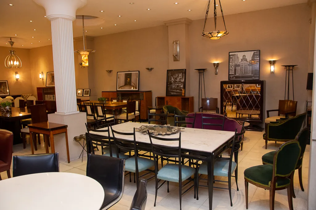 Antique pair of sconces providing soft light in an elegant room