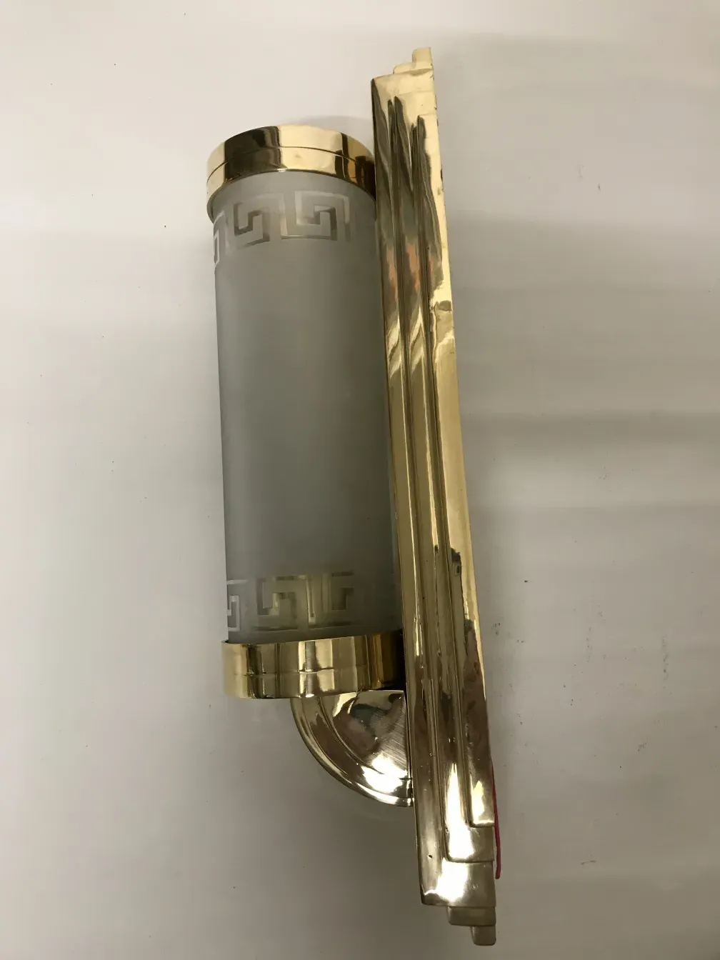 Antique pair of sconces with soft light and glass design.