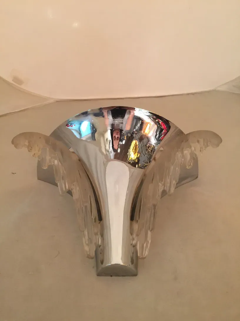 Pair of antique sconces featuring a shiny and elegant design, suitable for various decor styles.