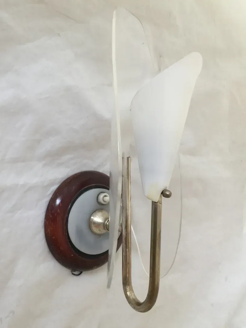 Beautiful antique pair of sconces with elegant minimalist style, wooden base.