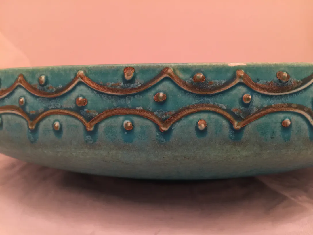 Antique blue ceramic with decorative design