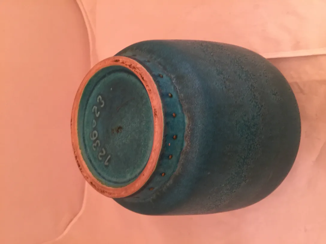 View of the bottom of an antique blue ceramic with details