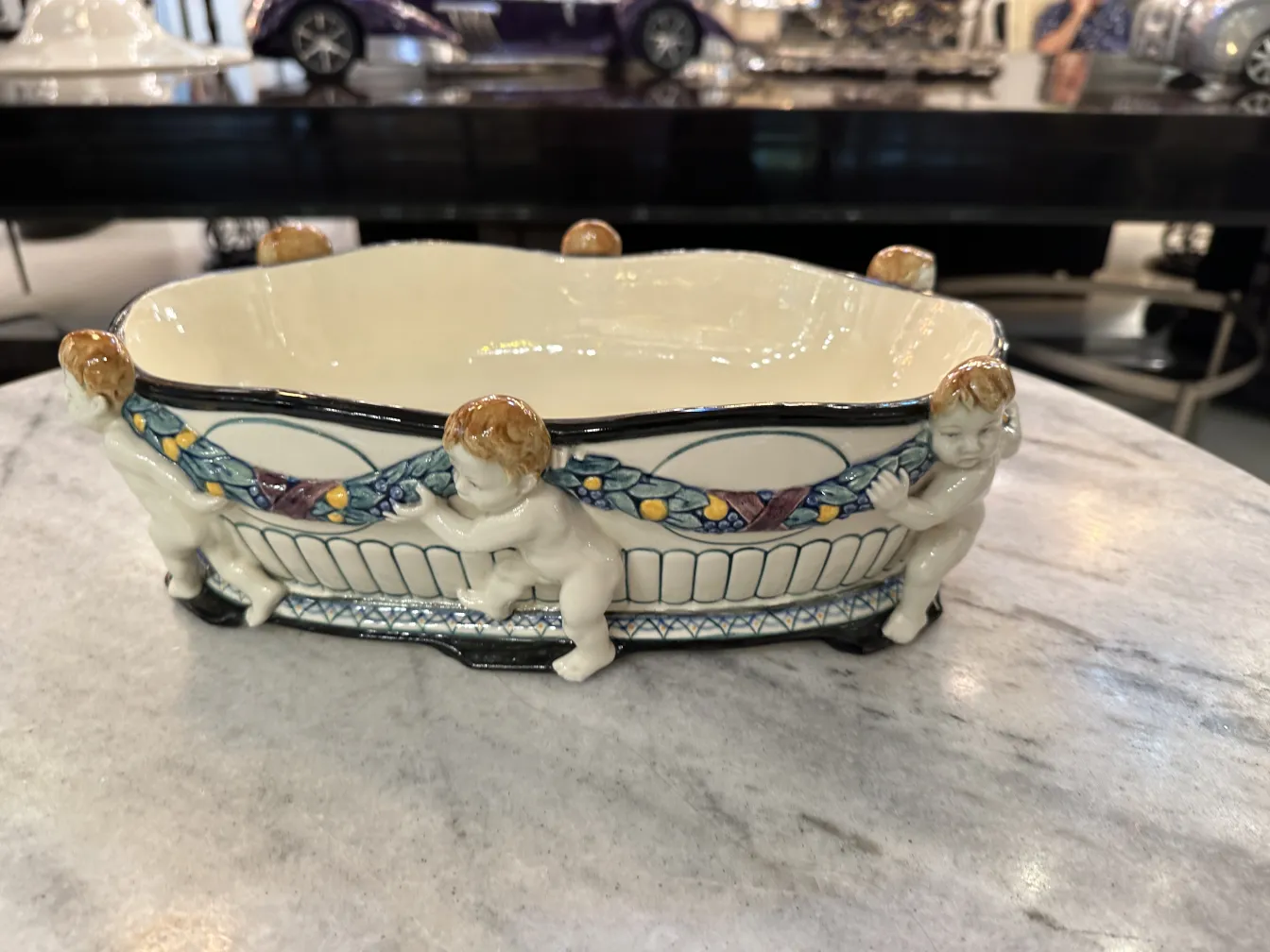 Antique ceramic bowl adorned with figures and vibrant colors