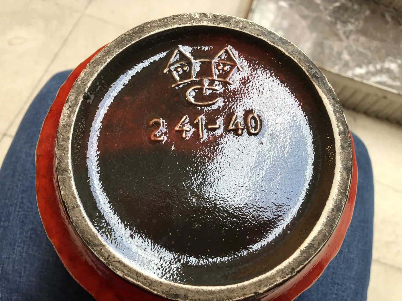 Antique ceramic base with artisanal decoration and visible details, cozy ambiance.