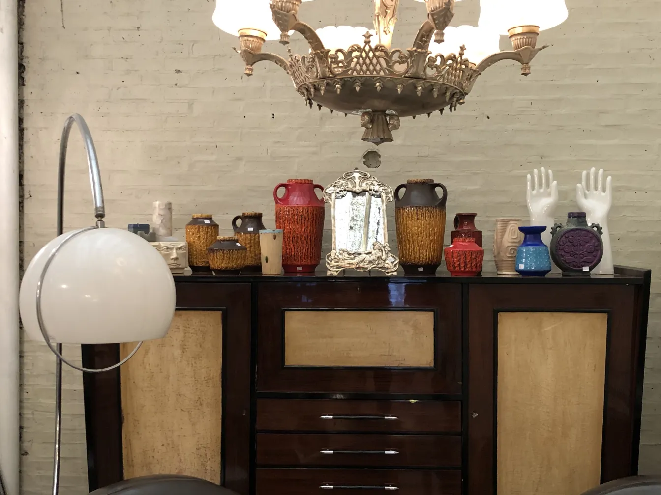 Antique ceramic pieces of various designs and colors in a cozy setting