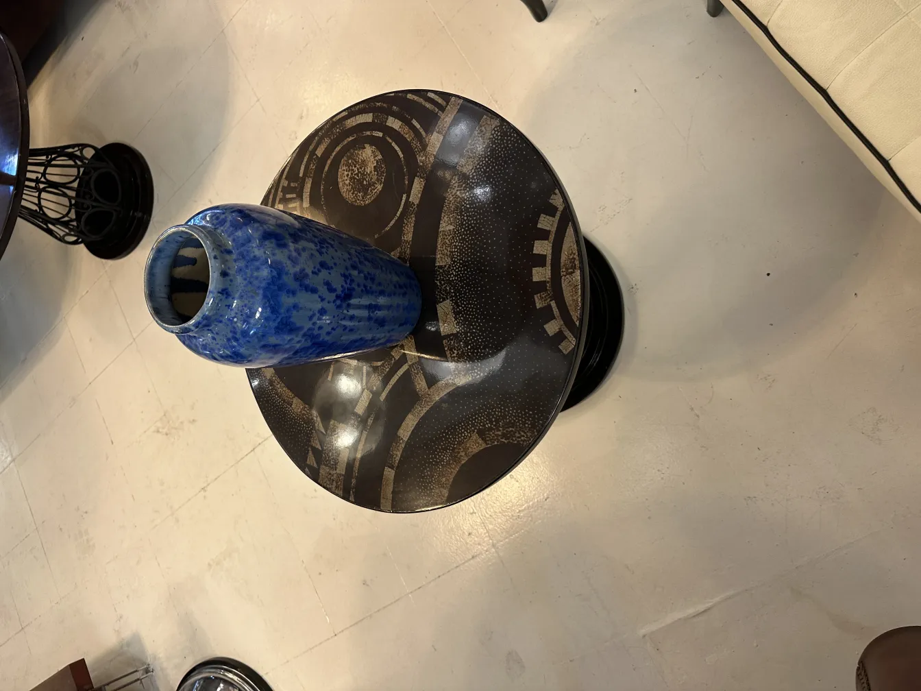 Antique decorative ceramic blue vase on table.