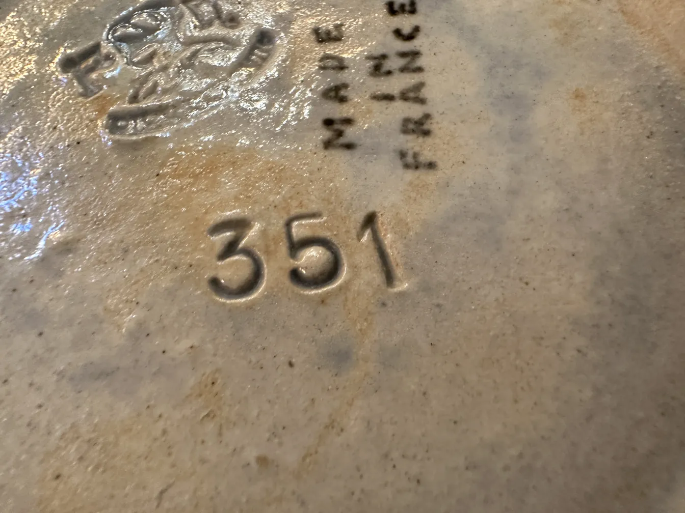 Detail of antique French ceramic with inscriptions