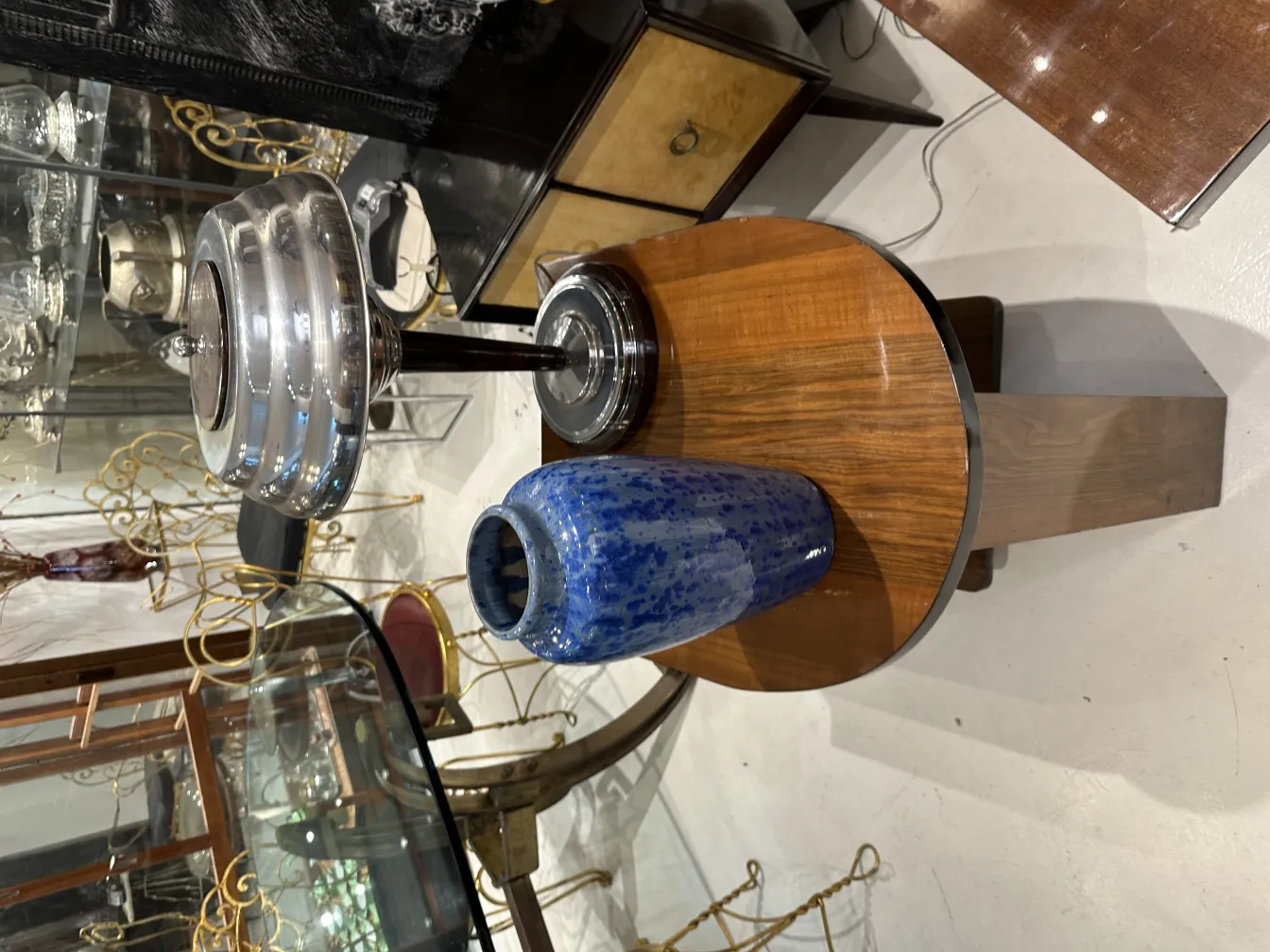 Antique blue ceramic vase on wooden table