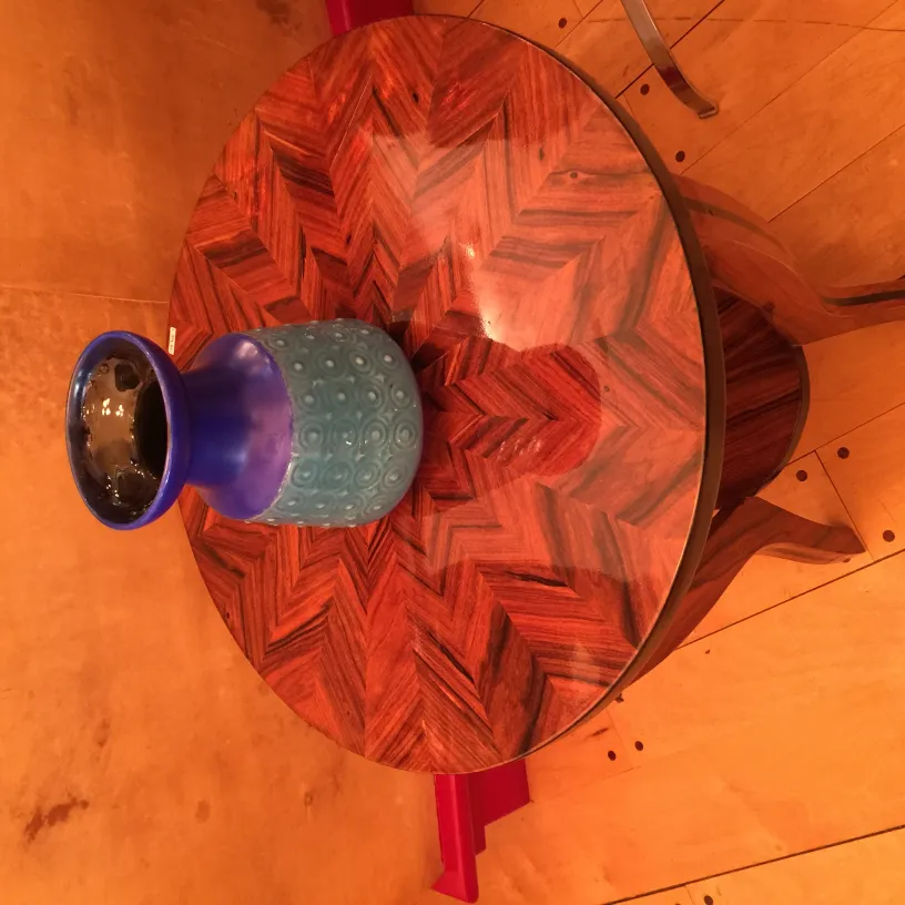 Antique ceramic vase in blue and black on an elegant table.