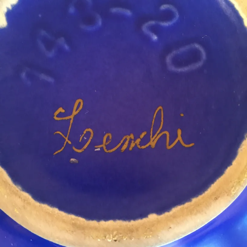 Antique ceramic with blue decoration, light background