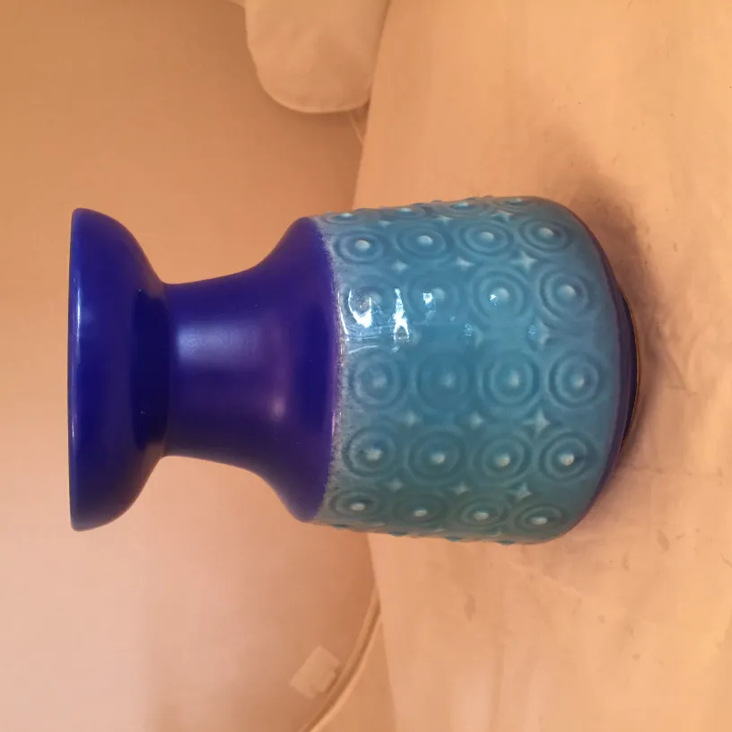 antique blue ceramic vase with circular pattern