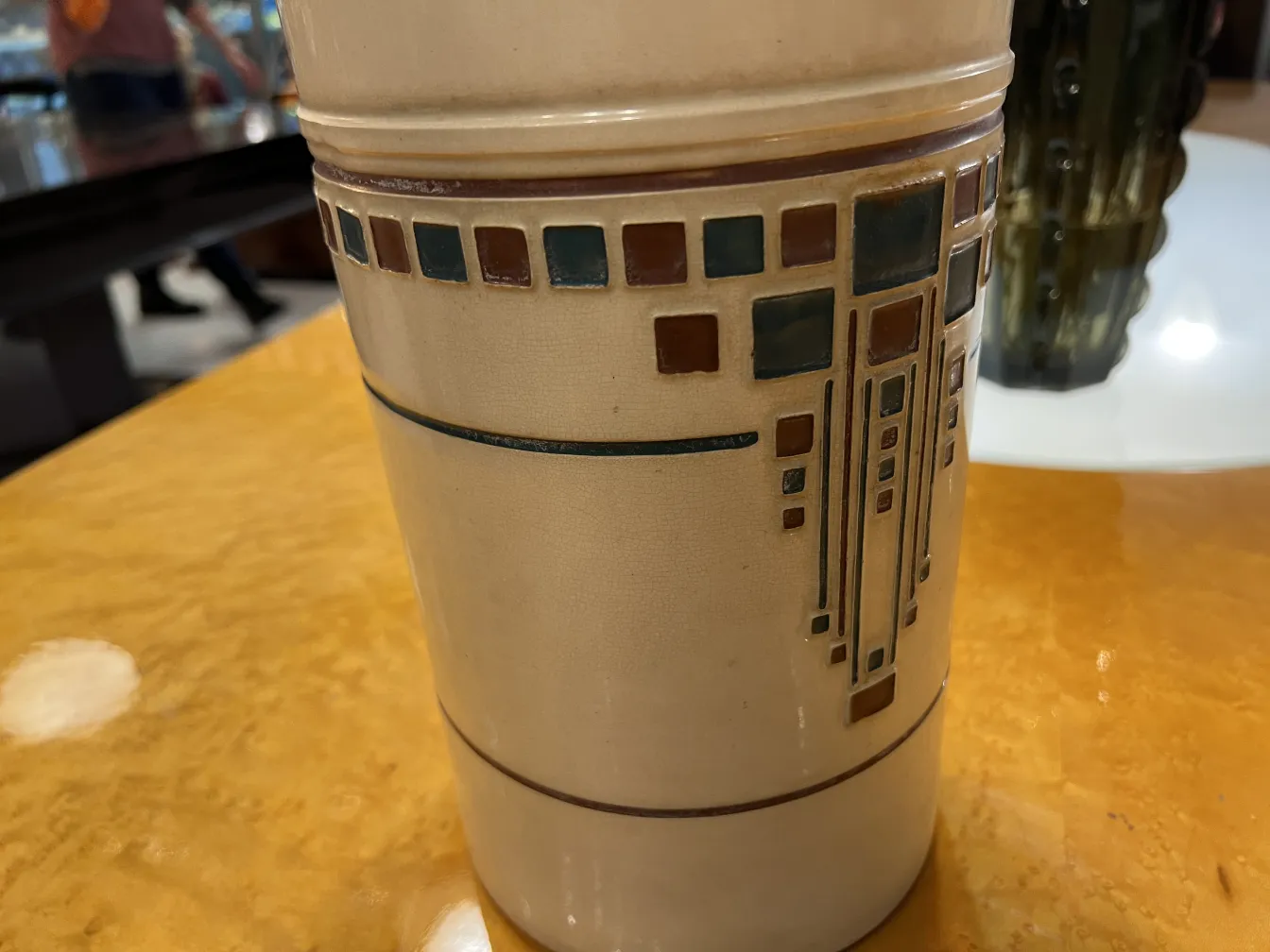 Antique ceramic with geometric design in light colors