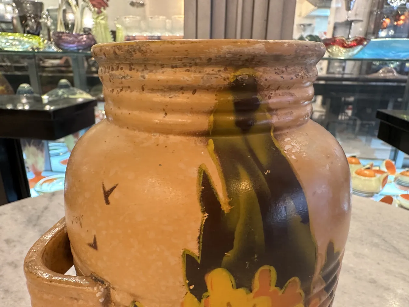 Hand-painted antique ceramic jar with floral motifs