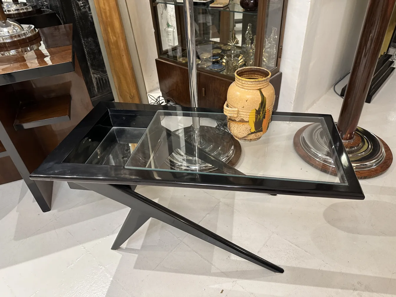 Antique ceramic jar with unique decoration placed in an antiques environment