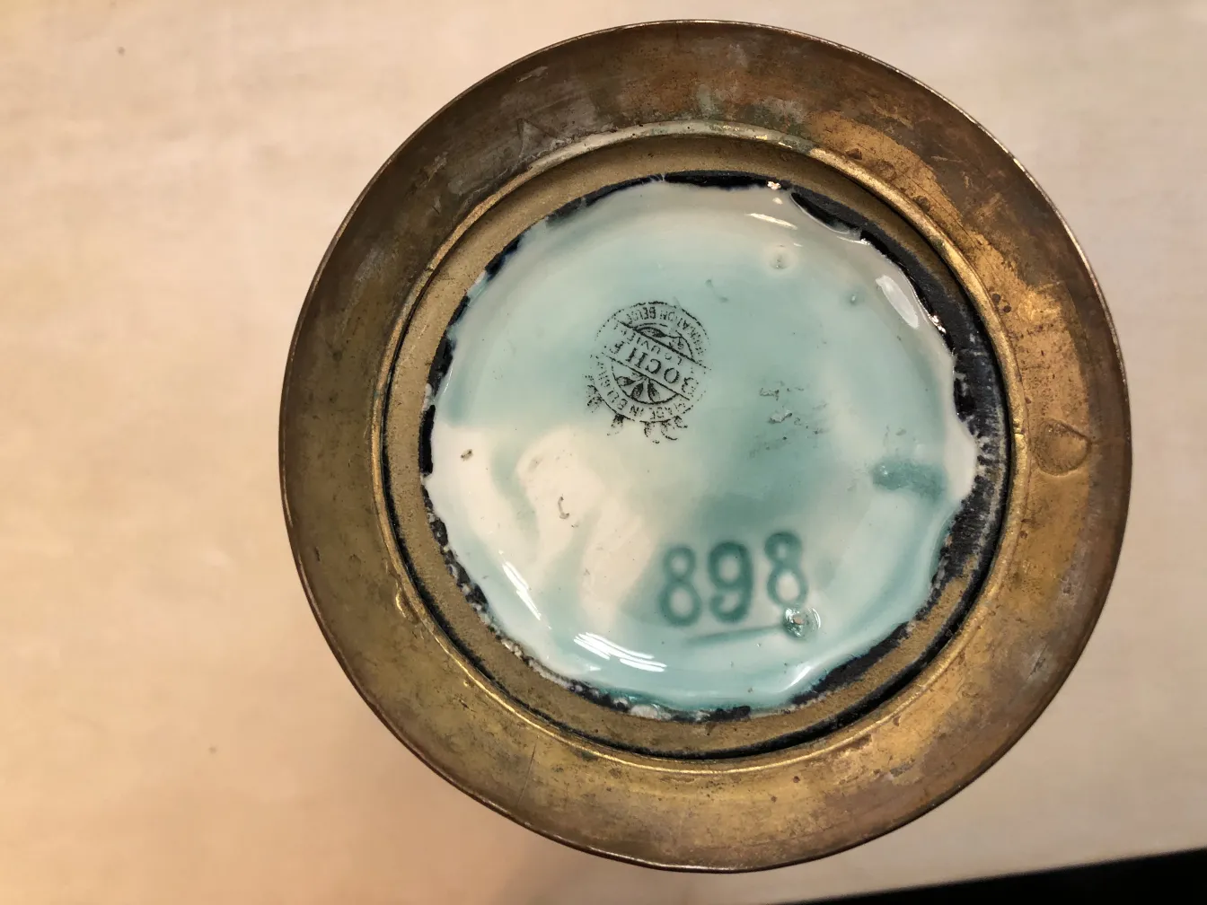 Top view of an antique decorative ceramic with design and number 898.