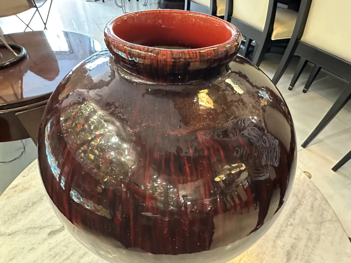 antique decorative ceramic in round shape, glossy brown color