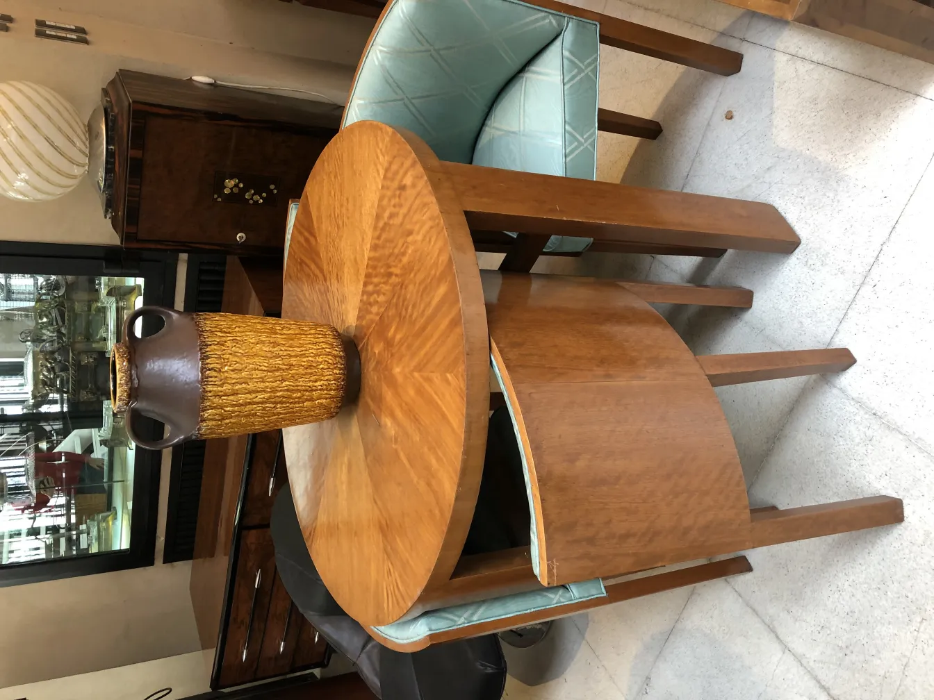 Antique ceramic vase with special texture on a table.