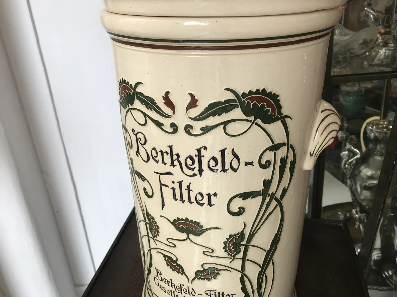 antique ceramic with floral decoration and lettering