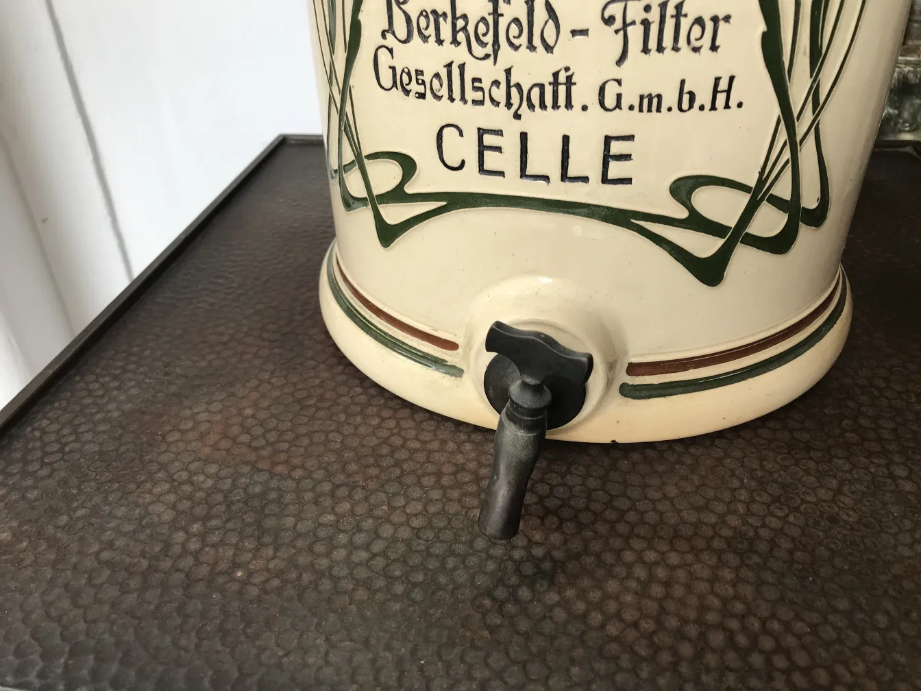 Antique ceramic container with tap, floral decoration