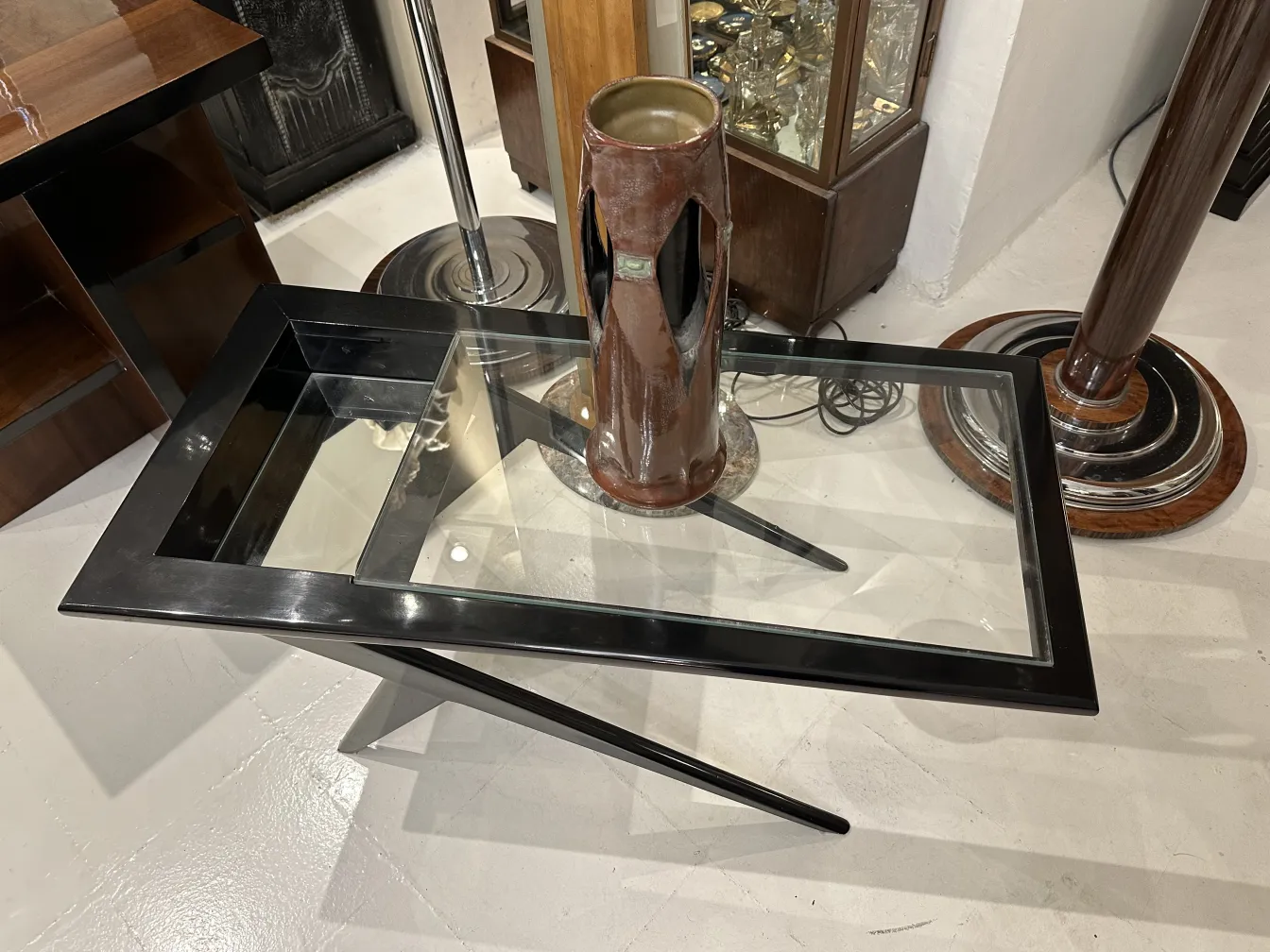 Antique ceramic vase on a black glass table