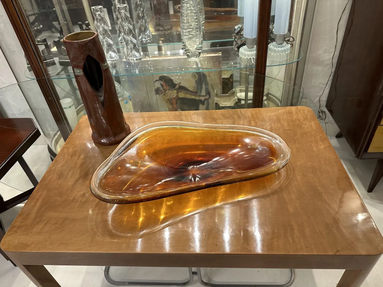 antique ceramic sculpture with fluid shapes and amber color