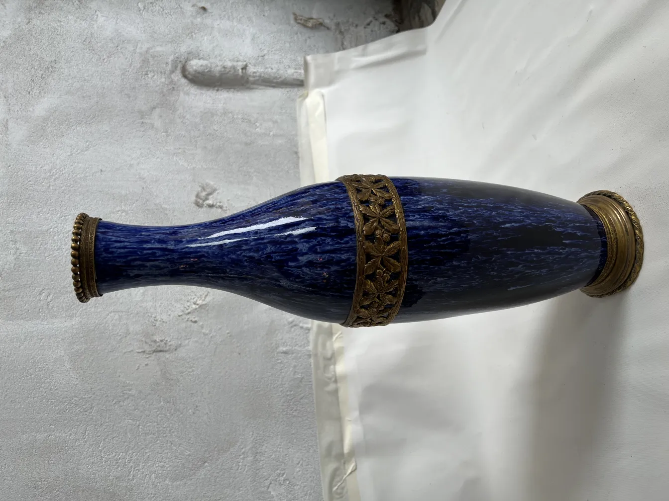 Antique blue ceramic vase with golden embellishments