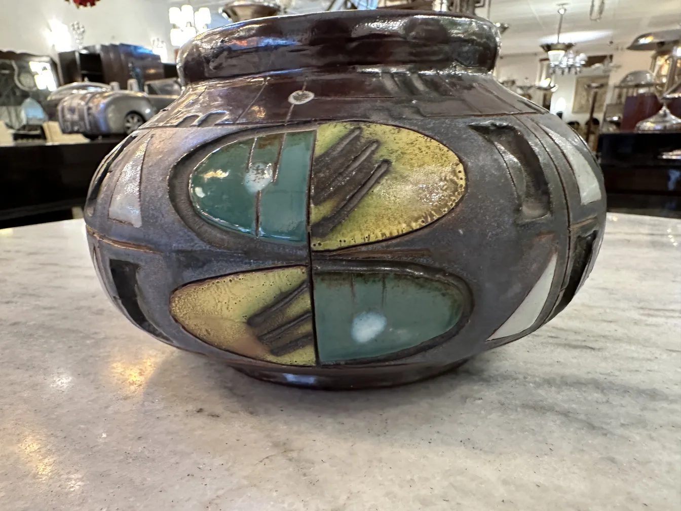 Antique ceramic vase featuring unique decorations, handcrafted.