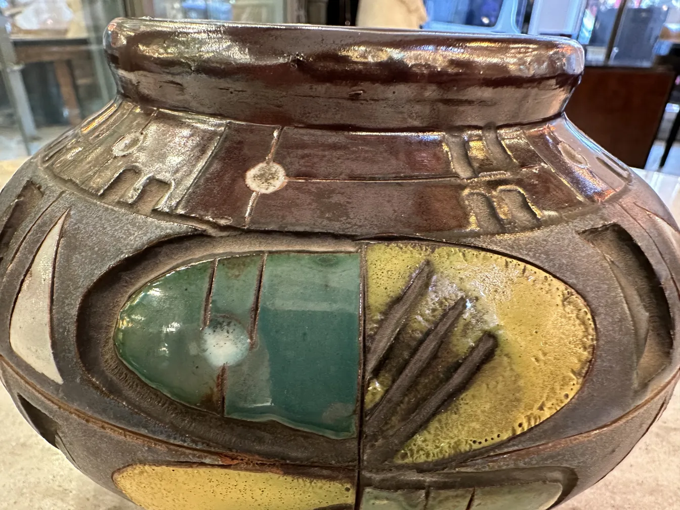 Ancient ceramic jar with colorful details and textures