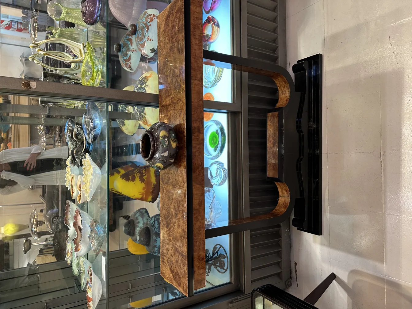 Antique ceramic with decorative details in a display case.