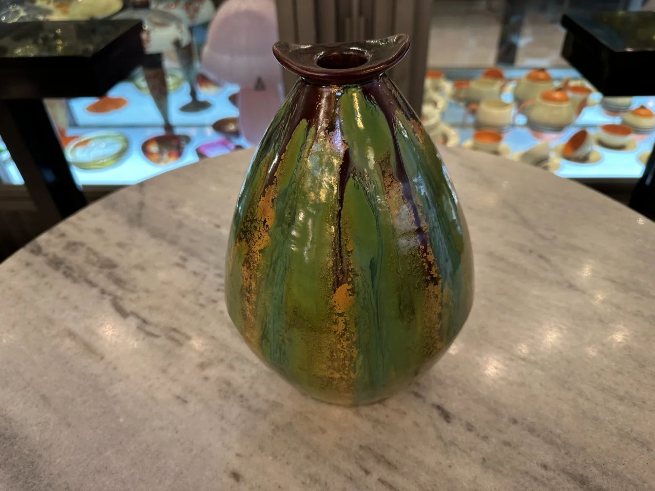 Antique ceramic vase with vibrant and bright patterns.