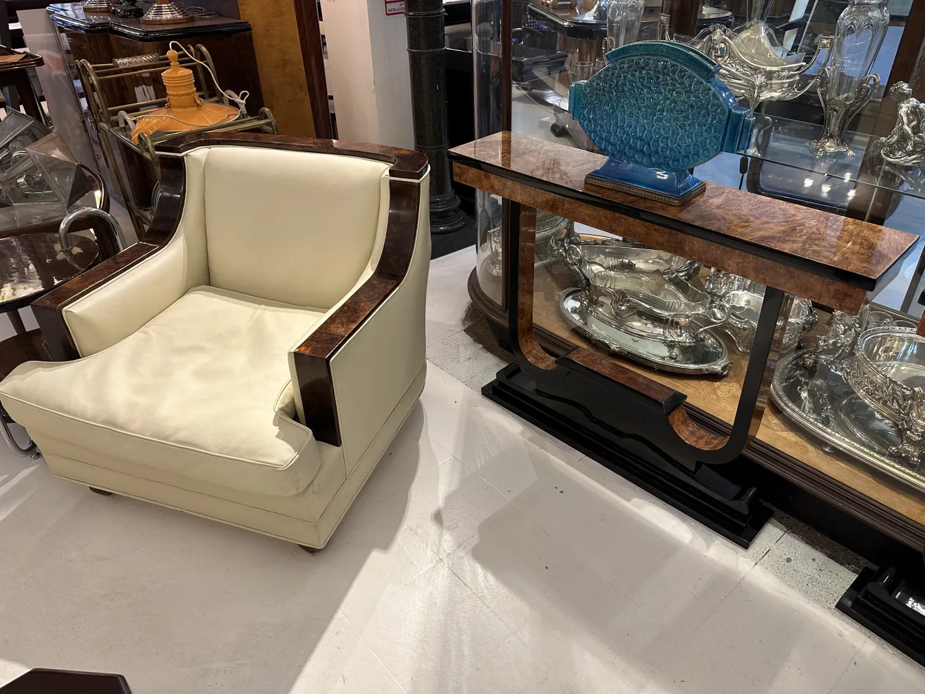 Antique decorative ceramic on a wooden table with chairs.