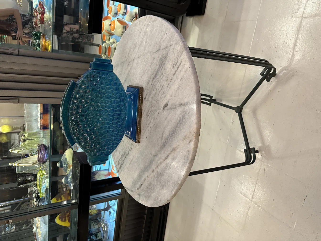 Antique decorative ceramic vase in blue on a table