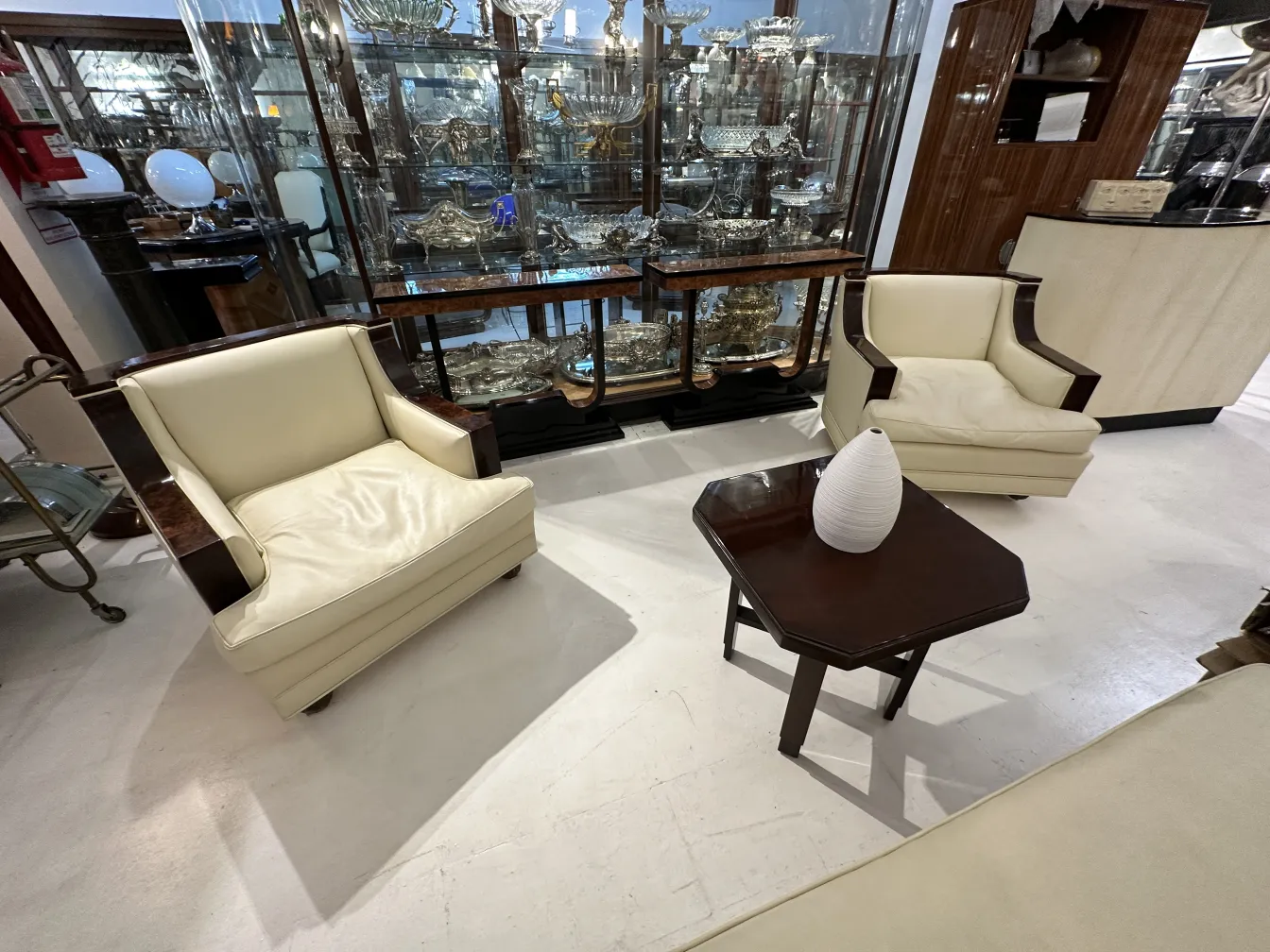 Antique decorative ceramic with elegant, smooth shape in a setting with other antique pieces.