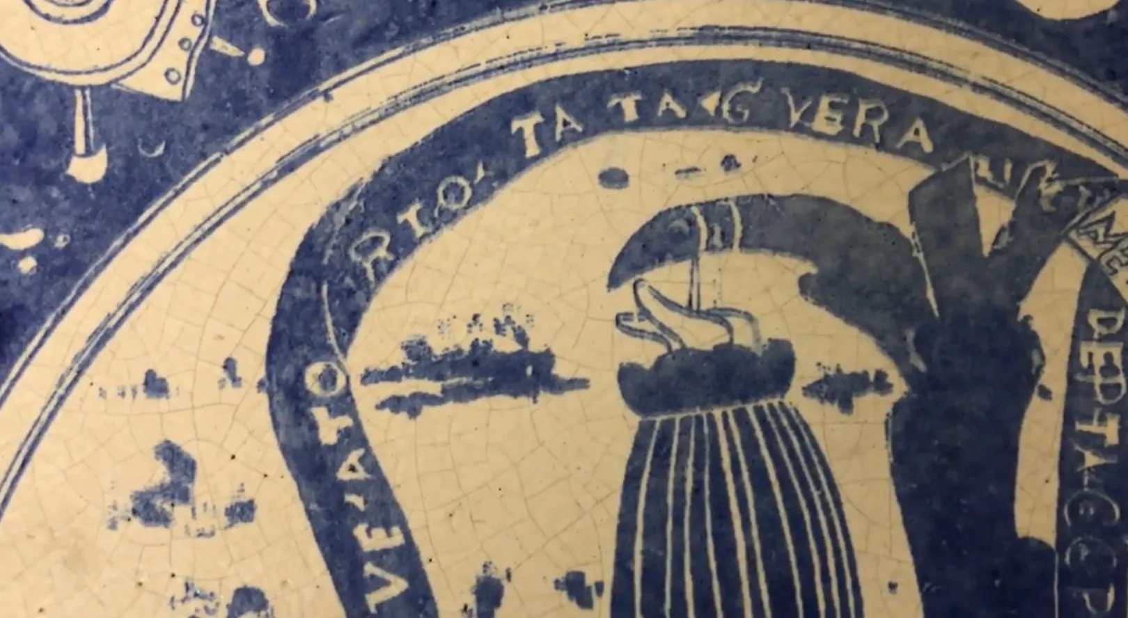 Antique ceramic with artistic design and vibrant colors in a classic setting.