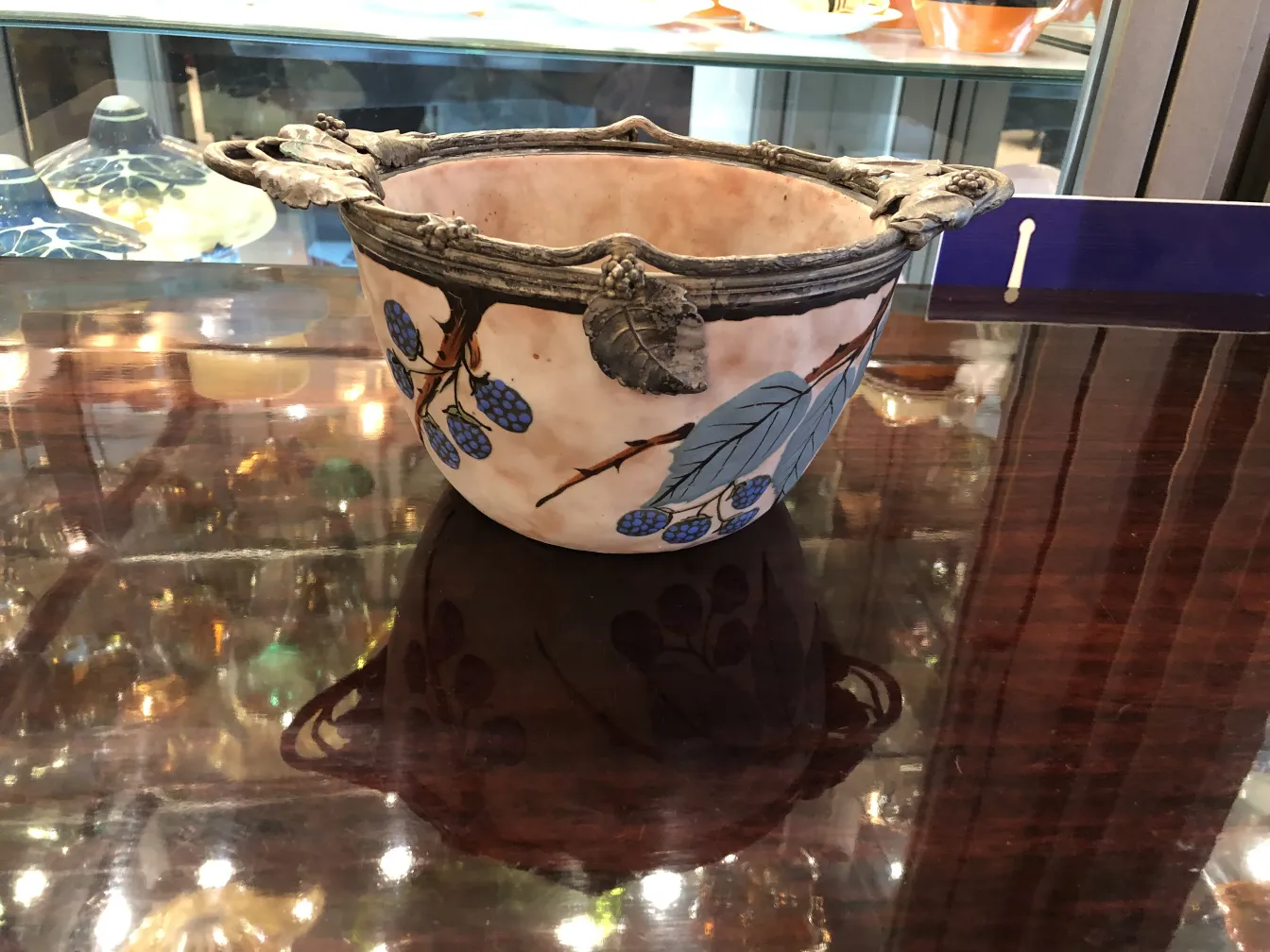 Beautiful antique ceramic decorated with leaves and berries, elegant.