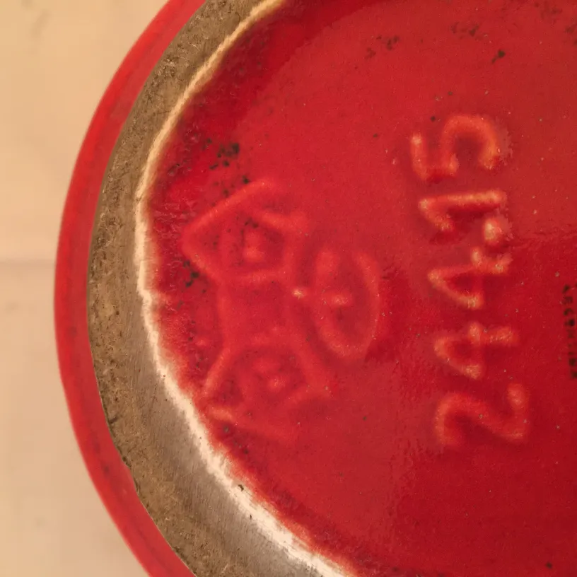 Antique red ceramic with decorative details