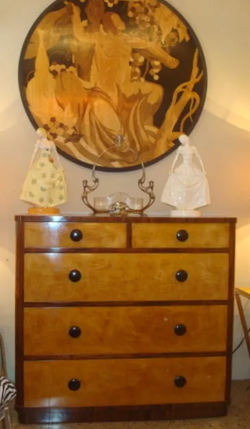 antique ceramic decoration on a dresser with gold details