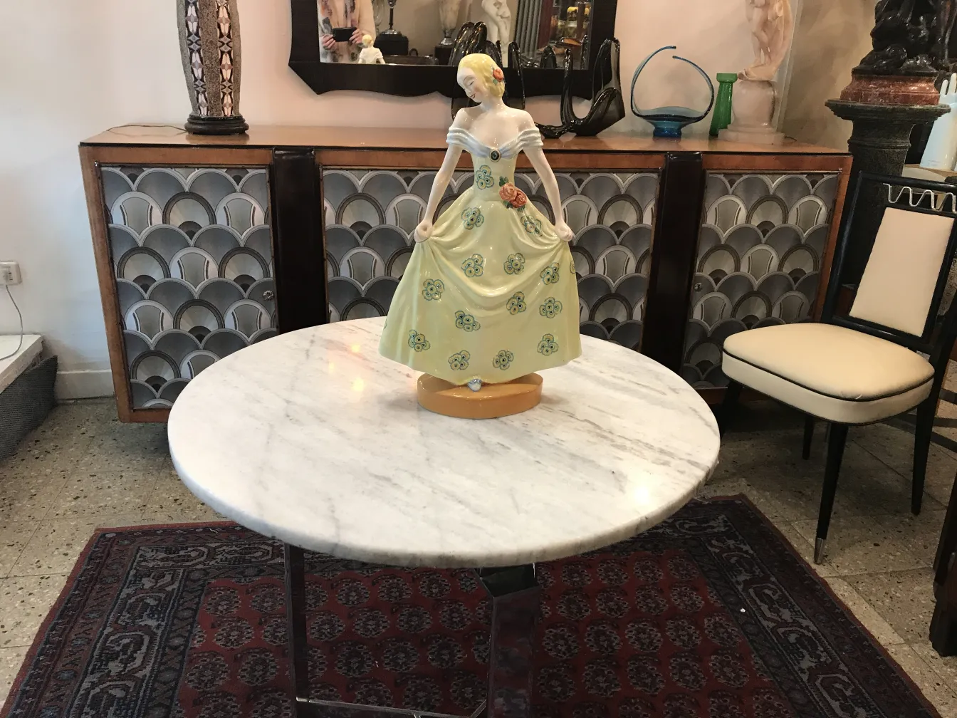 Antique ceramic figure with a green dress