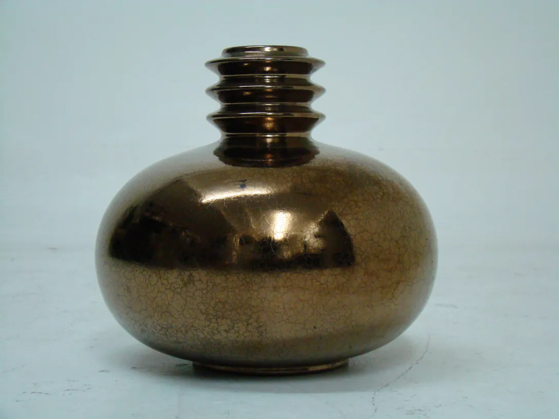 An antique ceramic vase with a shiny finish