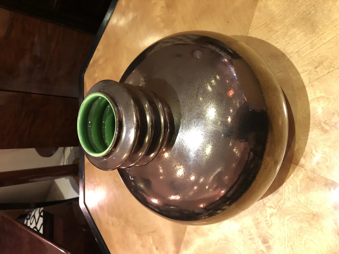 antique ceramic with a spherical shape and green details