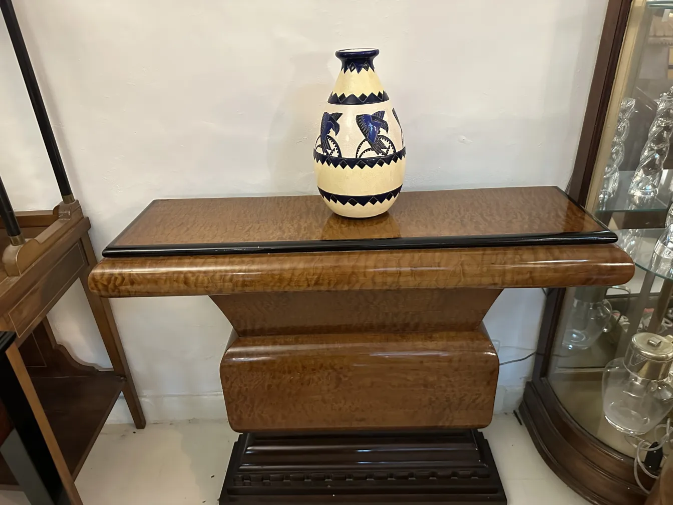 Antique ceramic decorative vase on a wooden table.