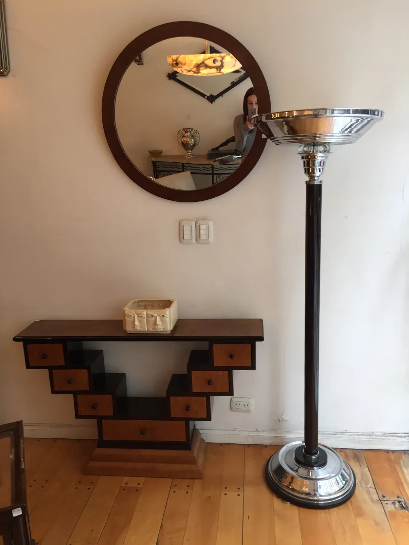 Decorative antique ceramic in a modern setting with shelves.