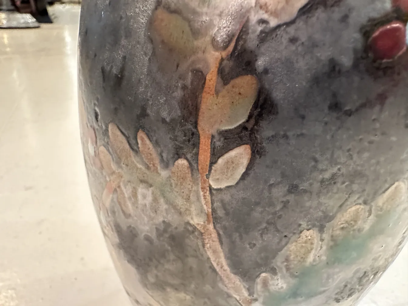 Antique ceramic decorated with floral designs and natural colors.