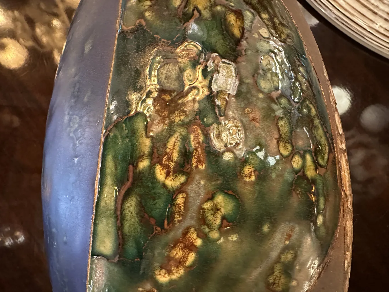 Antique ceramic piece with multicolor and shiny texture