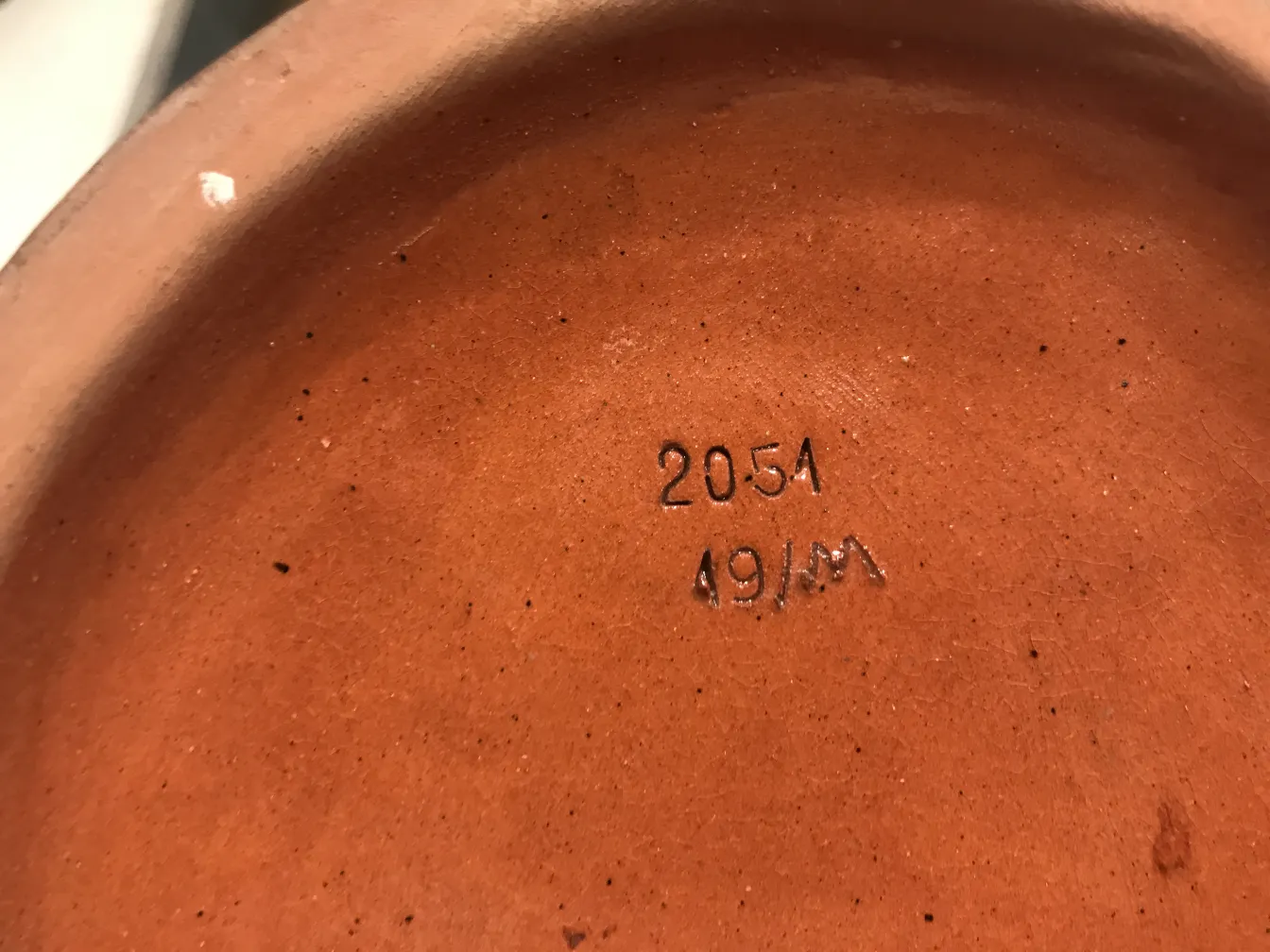 Interior of an antique ceramic piece with terracotta texture