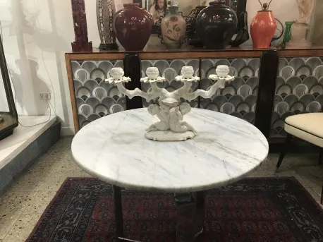 Antique ceramic candelabrum on marble table