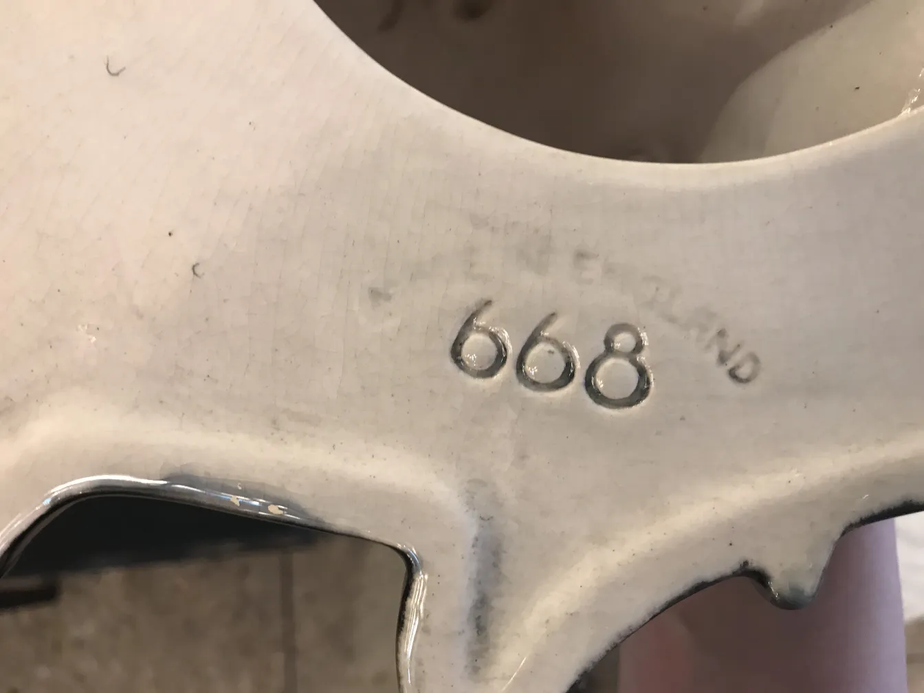 Antique English ceramic with raised detailing.