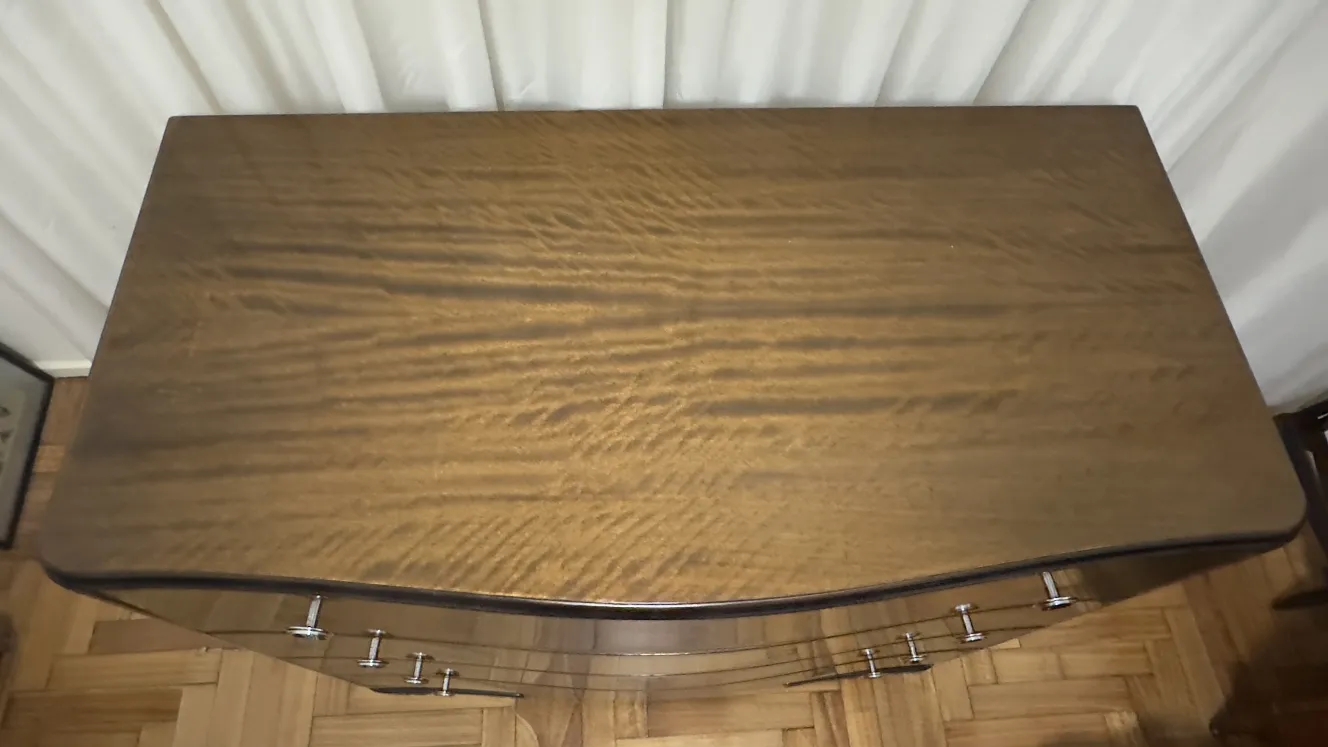 Top view of an antique wooden cabinet with metal handles.